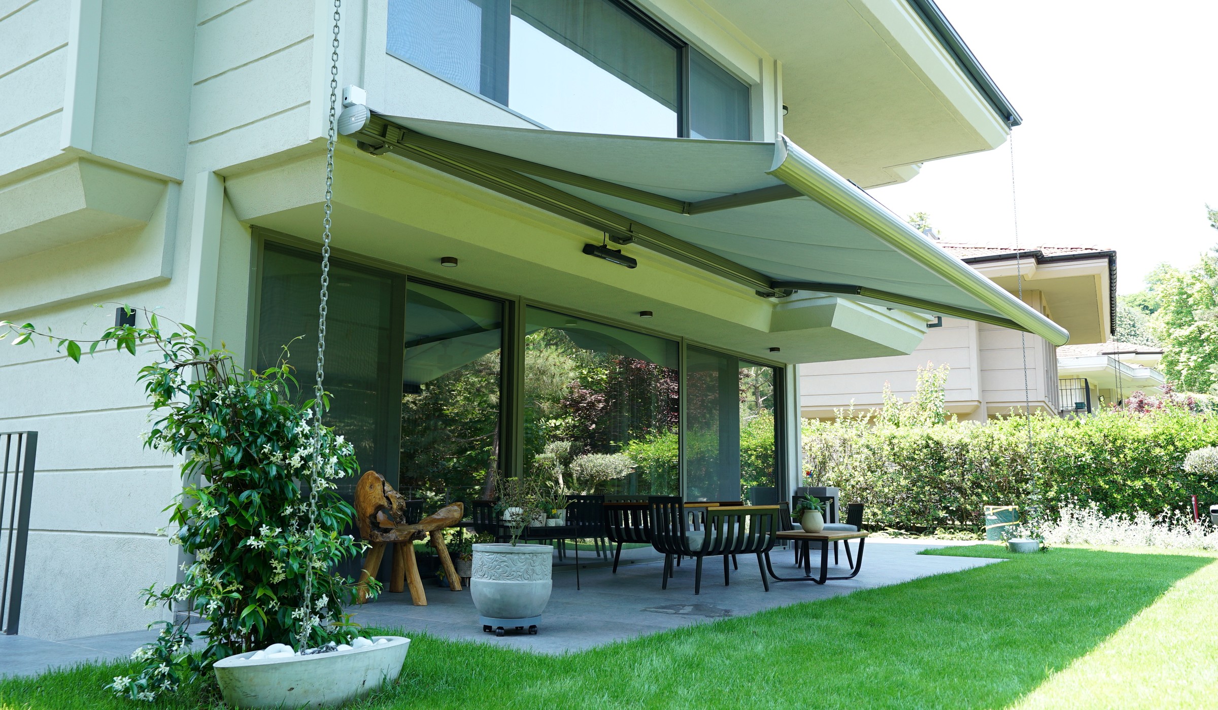 Folding arm awning on a contemporary villa facade