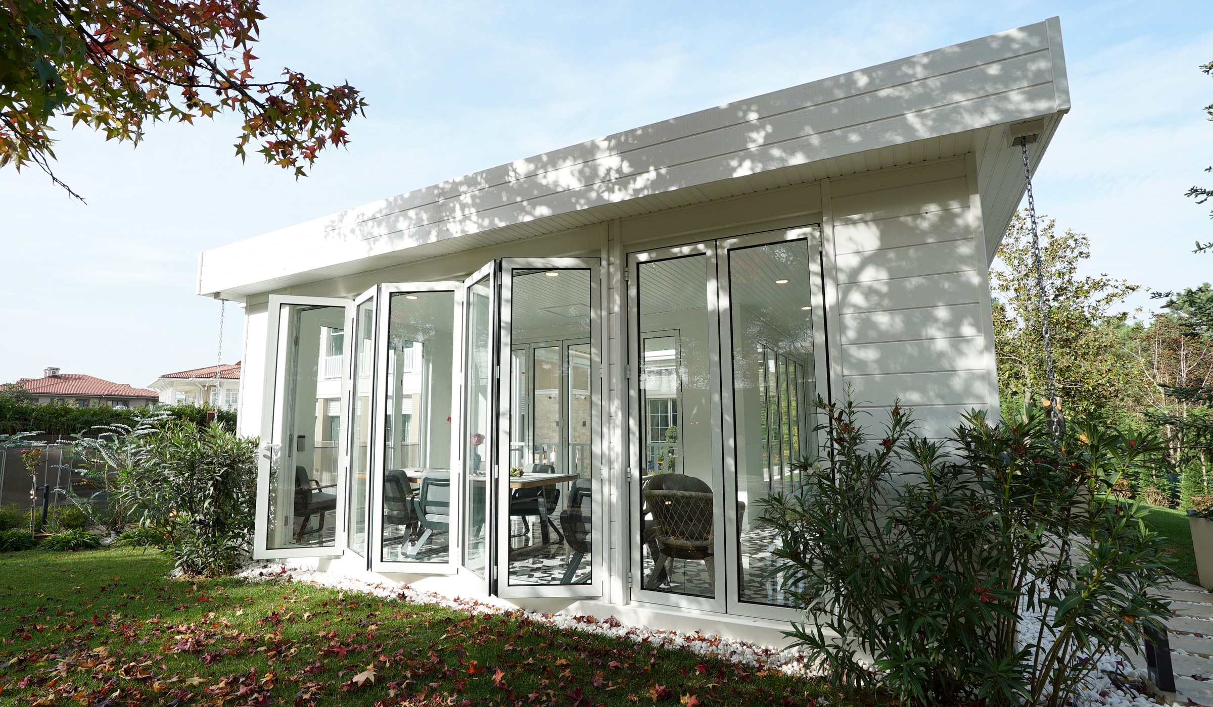 Winter garden with white accordion glass doors